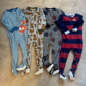 Set of four Carters zip footies